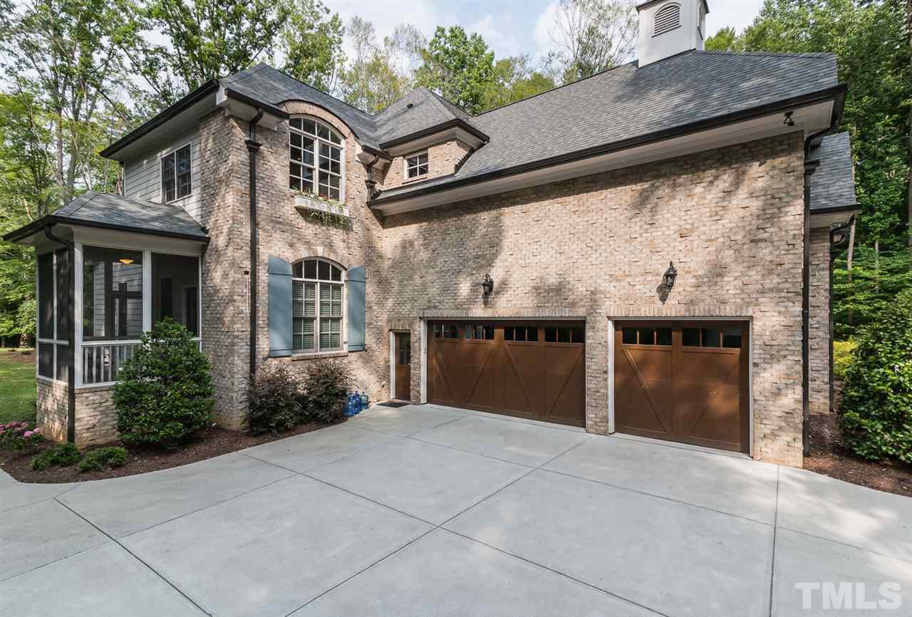 8841 Stage Ford Road Raleigh, NC 27615 - Photo 24 of 25 a front view of house with yard and trees around