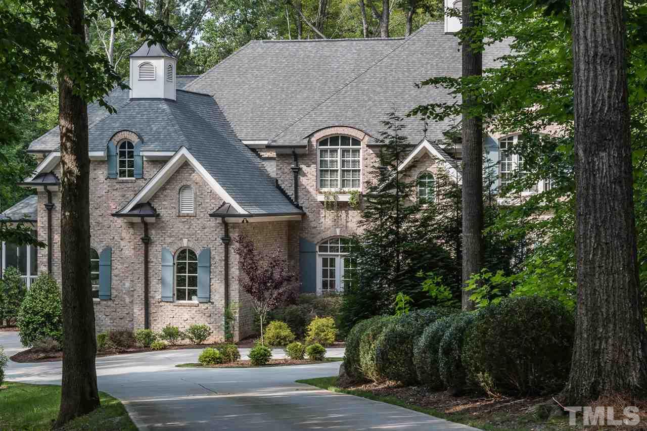 8841 Stage Ford Road Raleigh, NC 27615 - Photo 25 of 25 a front view of a house with garden