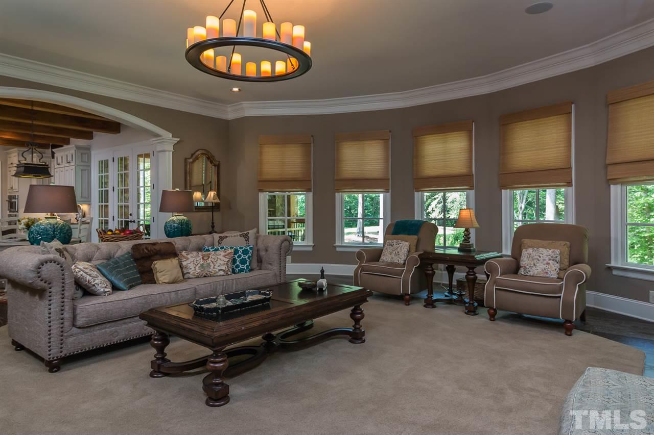 8841 Stage Ford Road Raleigh, NC 27615 - Photo 4 of 25 a living room with furniture and a large window