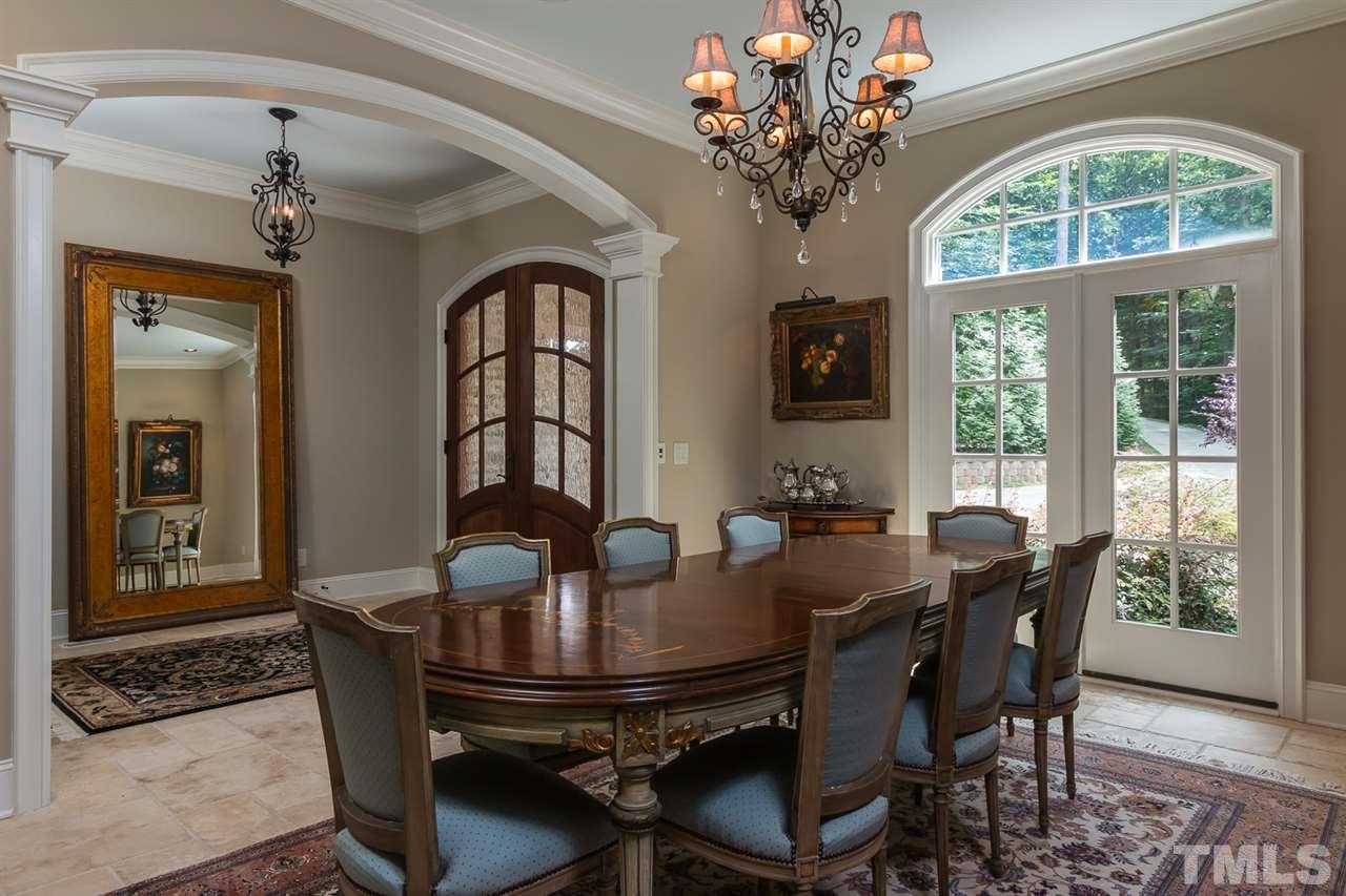 8841 Stage Ford Road Raleigh, NC 27615 - Photo 6 of 25 a view of a dining room with furniture window and outside view