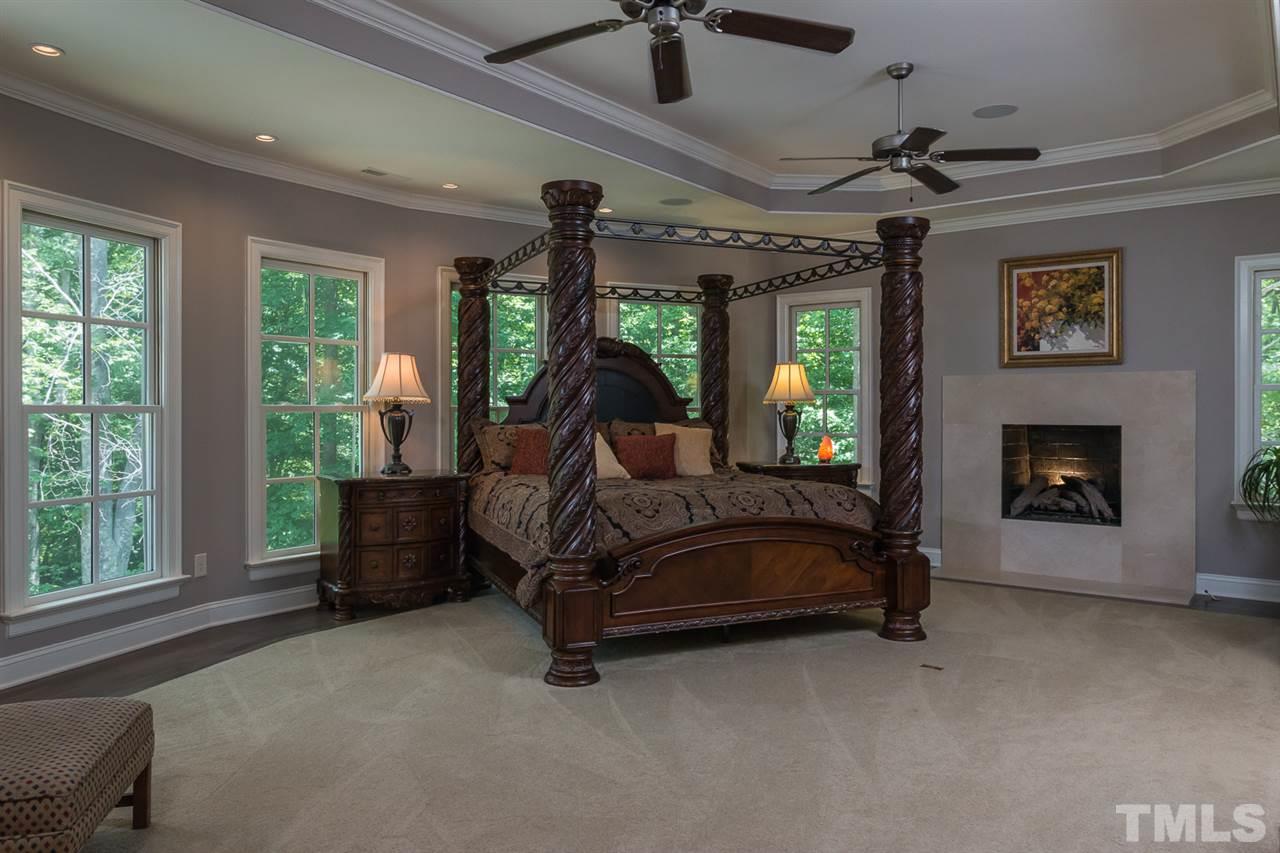 8841 Stage Ford Road Raleigh, NC 27615 - Photo 7 of 25 a bedroom with a bed mirror and window