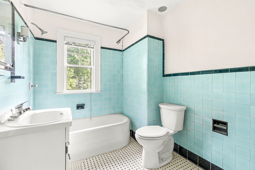 30 Rangeley Road Winchester, MA 01890 - Photo 30 of 42 a bathroom with a toilet sink and mirror