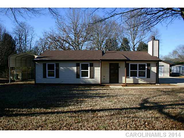 3317 Sandy Porter Road Charlotte, NC 28273 - Photo 1 of 12 a front view of a house with a yard