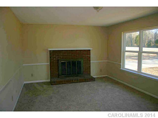 3317 Sandy Porter Road Charlotte, NC 28273 - Photo 6 of 12 a living room with a fireplace