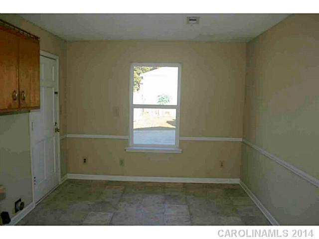 3317 Sandy Porter Road Charlotte, NC 28273 - Photo 8 of 12 a view of an empty room with a window