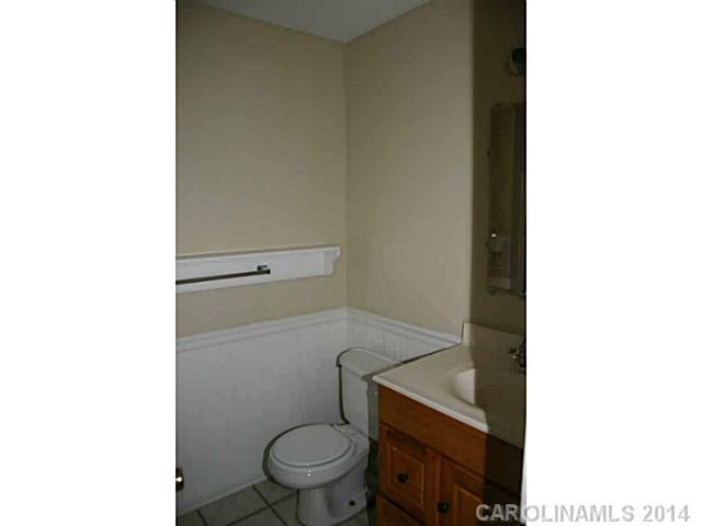 3317 Sandy Porter Road Charlotte, NC 28273 - Photo 10 of 12 a bathroom with a toilet and a sink