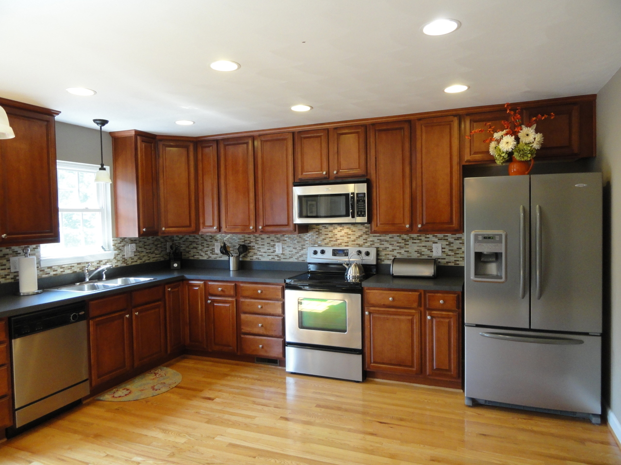 2826 Green Ridge Road Roanoke, VA 24019 - Photo 11 of 21 a kitchen with stainless steel appliances granite countertop a refrigerator a sink dishwasher a stove top oven a sink and dishwasher with wooden floor