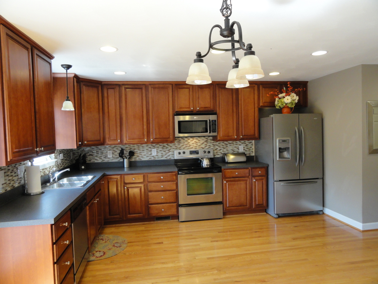 2826 Green Ridge Road Roanoke, VA 24019 - Photo 12 of 21 a kitchen with stainless steel appliances granite countertop a sink refrigerator and microwave