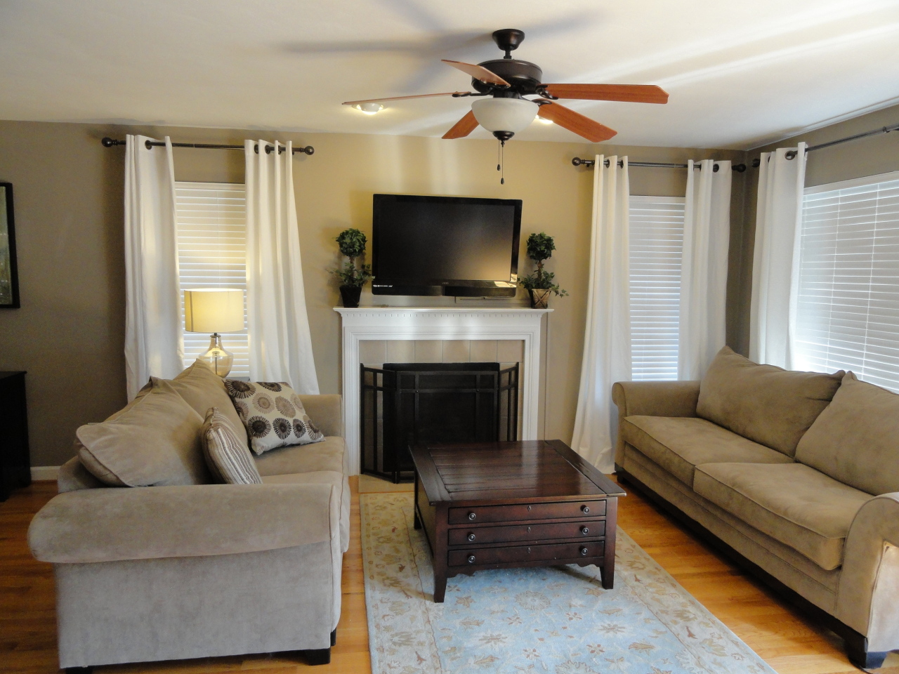 2826 Green Ridge Road Roanoke, VA 24019 - Photo 9 of 21 a living room with furniture a flat screen tv and a fireplace