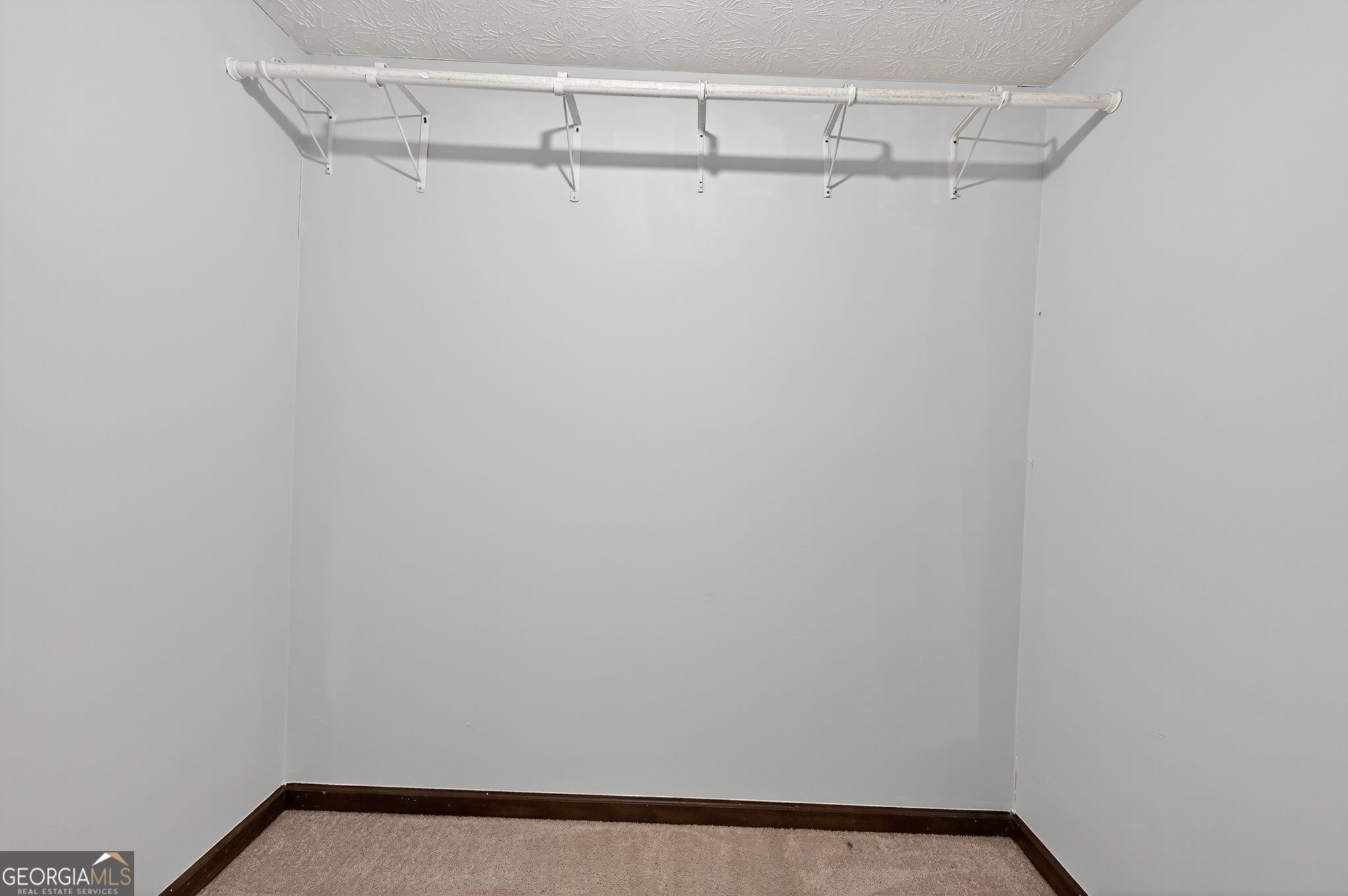 1378 Stoneleigh Hill Road Lithonia, GA 30058 - Photo 13 of 32 a view of a room with racks on the wall