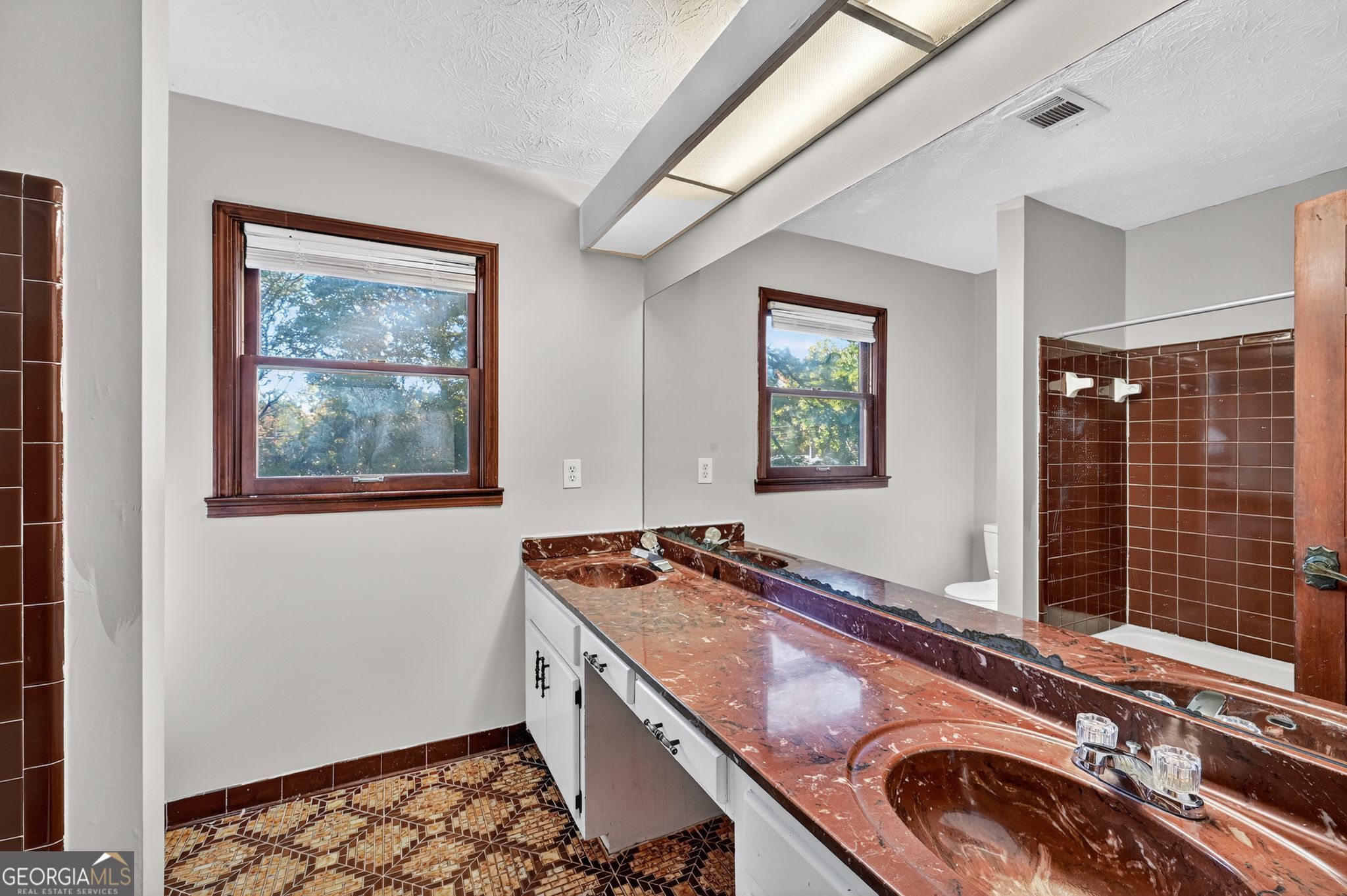 1378 Stoneleigh Hill Road Lithonia, GA 30058 - Photo 14 of 32 a bathroom with a granite countertop sink and a window