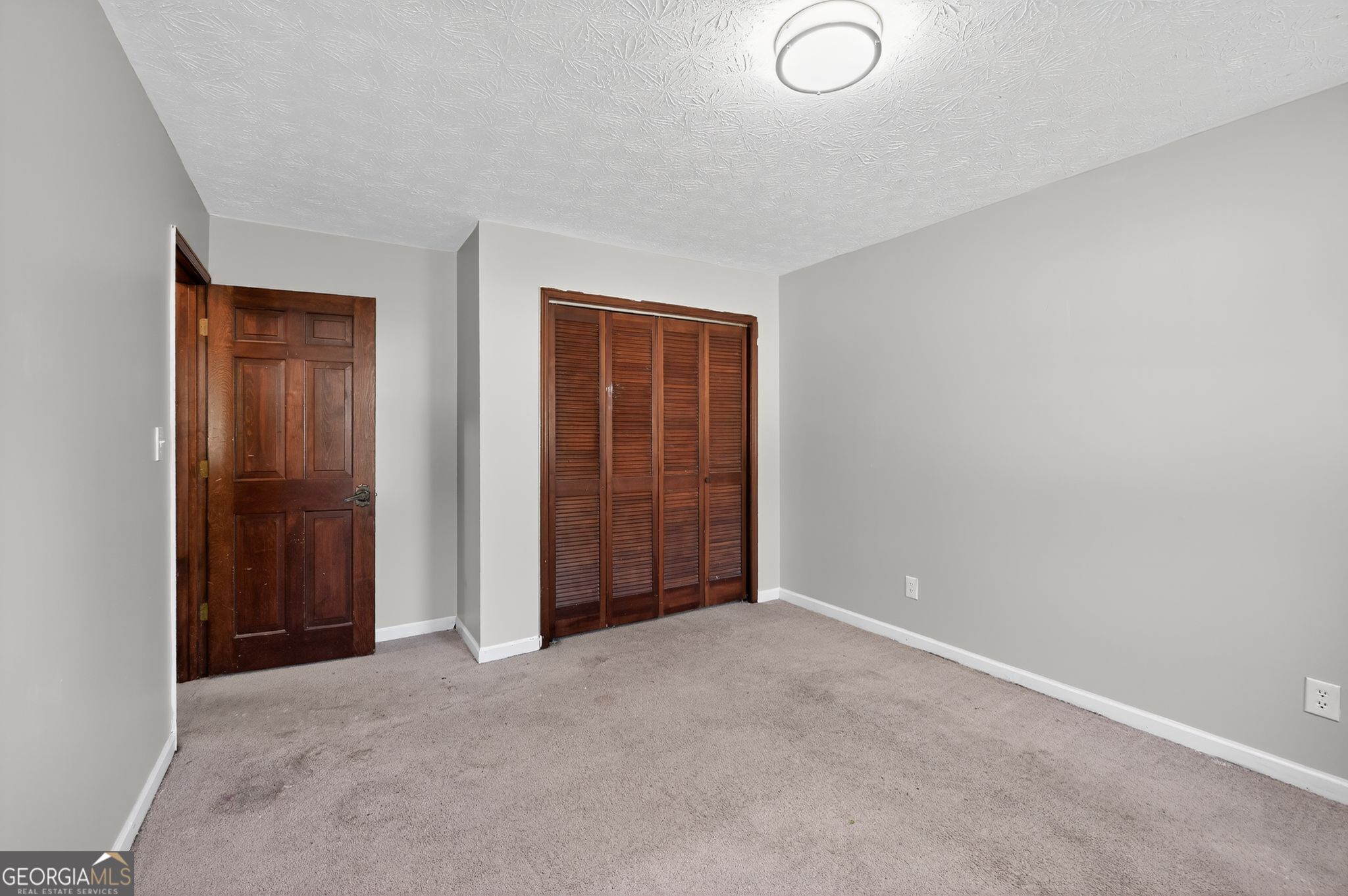 1378 Stoneleigh Hill Road Lithonia, GA 30058 - Photo 19 of 32 an empty room with closet area
