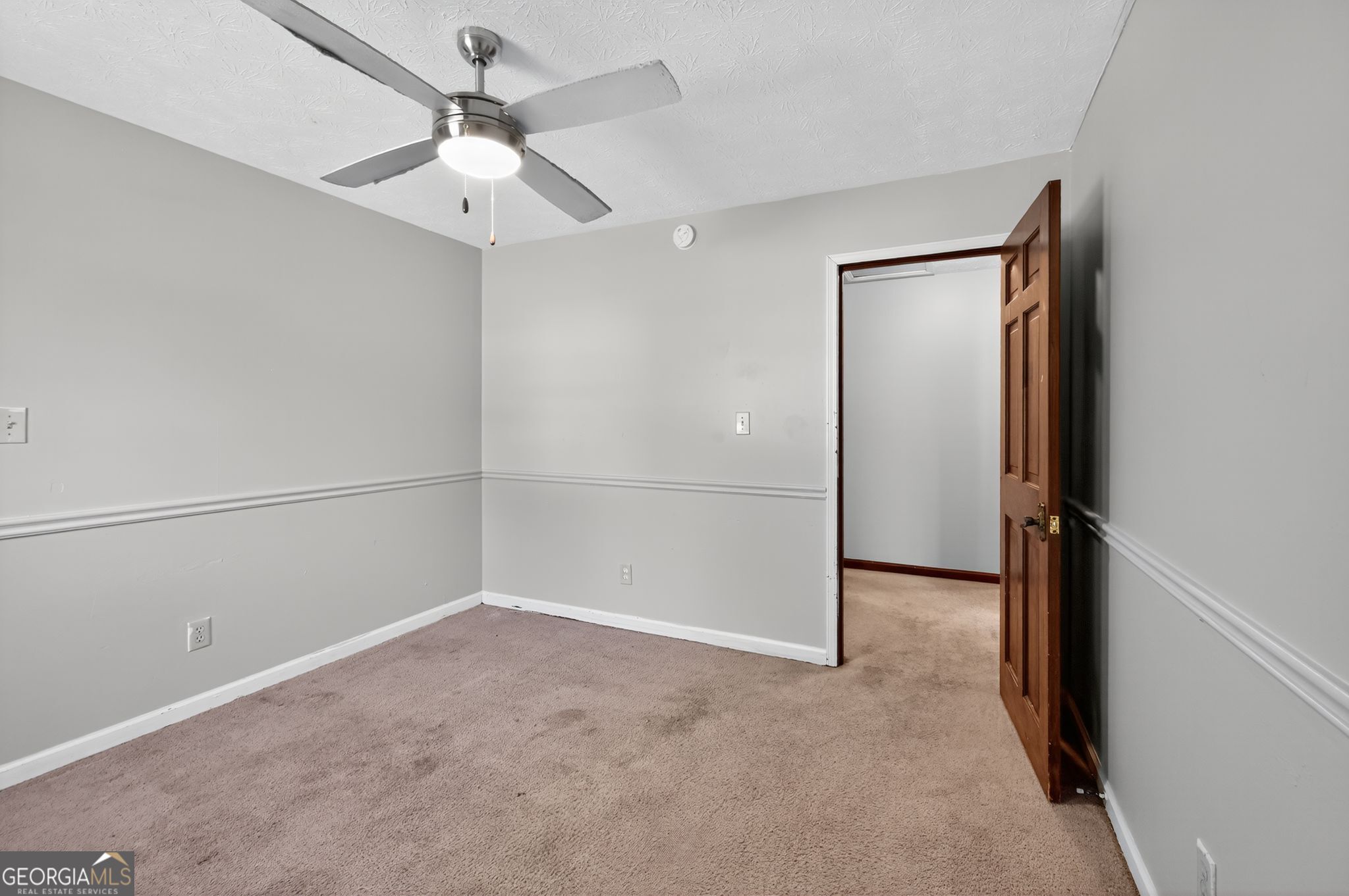 1378 Stoneleigh Hill Road Lithonia, GA 30058 - Photo 28 of 32 an empty room with closet and windows