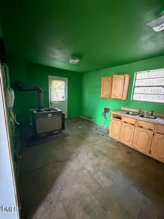 a living room with furniture and a open window