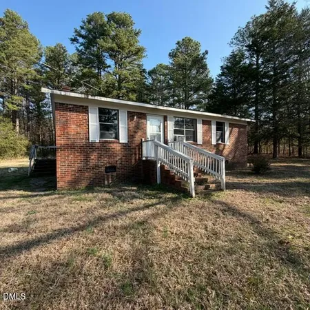 a house with trees in the background