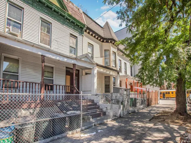 a front view of a house with parking