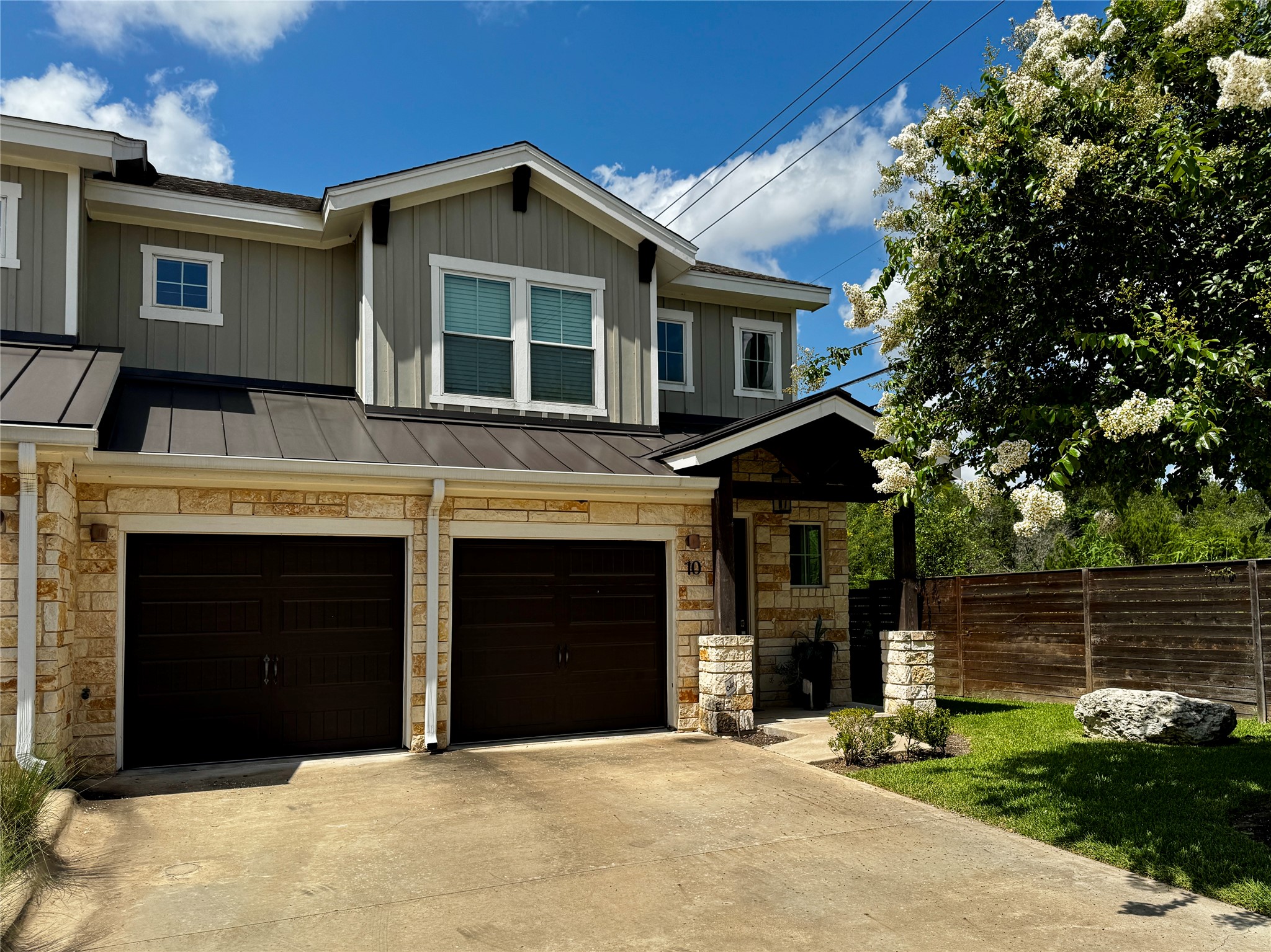 6515 Davis Lane, Unit 10 Austin, TX 78749 - Photo 1 of 22 A well-maintained facade combines stone accents and board-and-batten siding.
