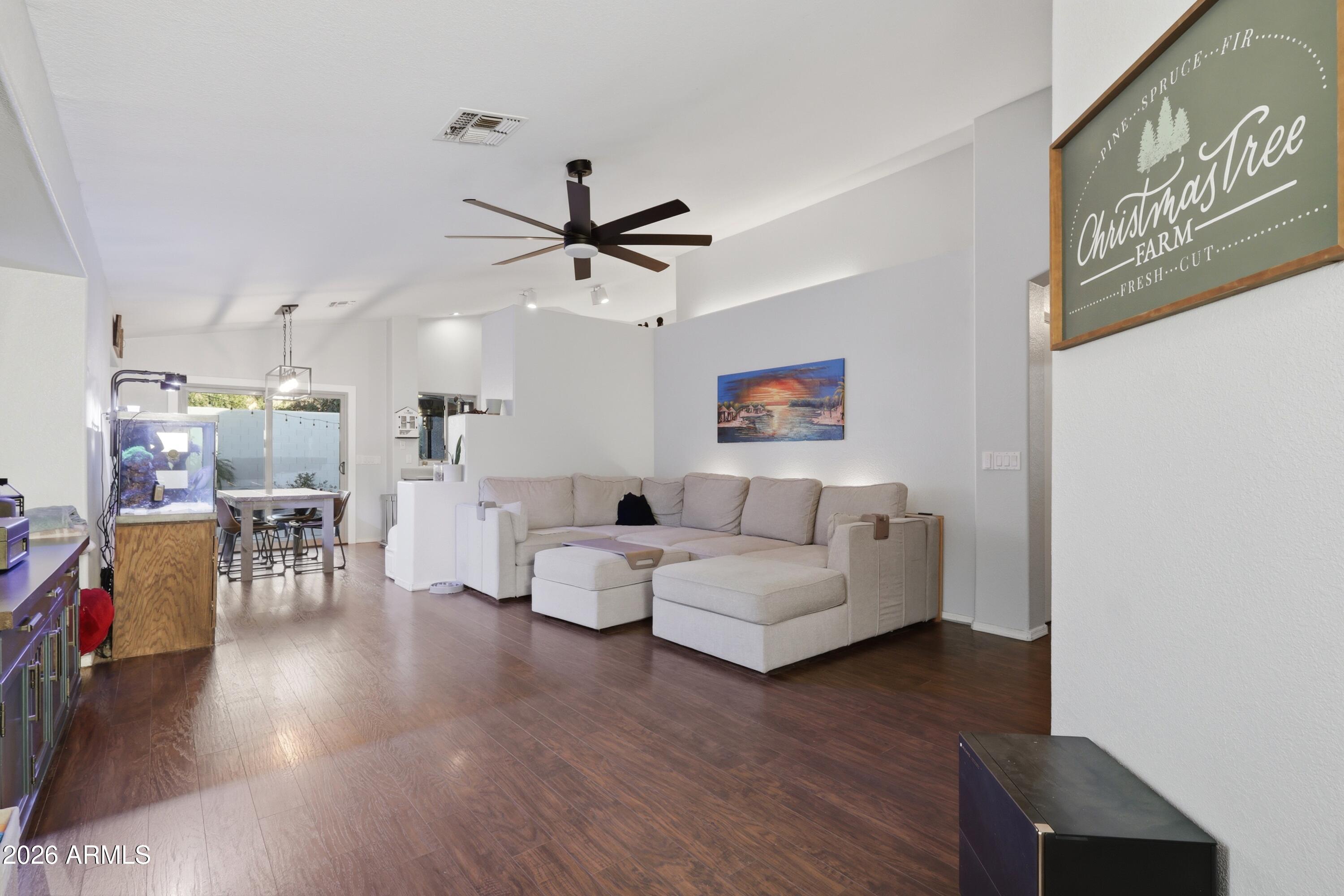 661 North Joshua Tree Lane Gilbert, AZ 85234 - Photo 5 of 47 a living room with furniture and wooden floor