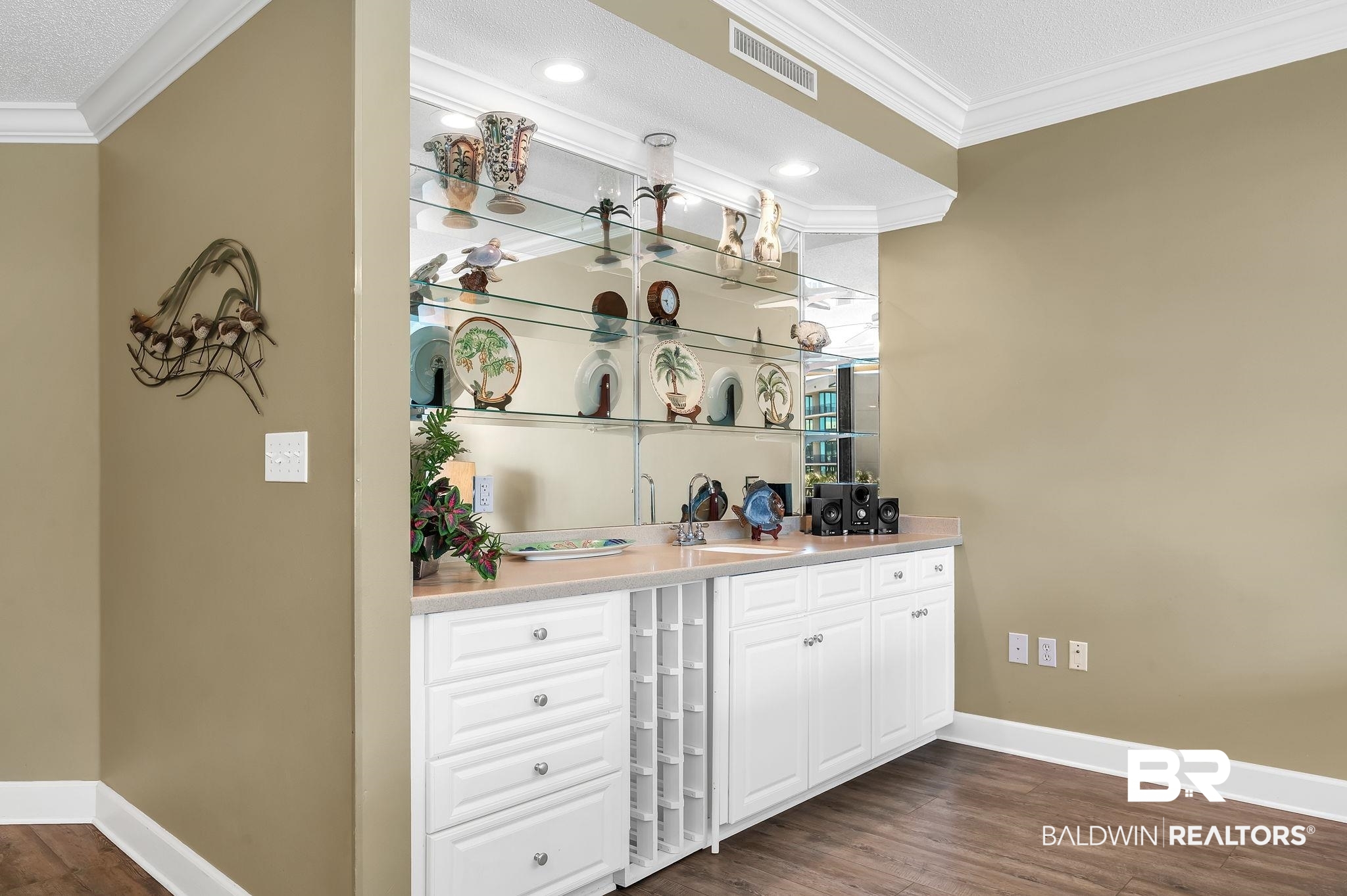 27580 Canal Road, Unit 1214 AND BOAT SLIP #62 Orange Beach, AL 36561 - Photo 22 of 67 Bar featuring visible vents, baseboards, and crown molding