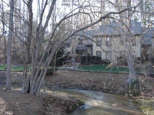 201 Broad Leaf Circle Raleigh, NC 27613 - Photo 3 of 5 a view of a yard with trees