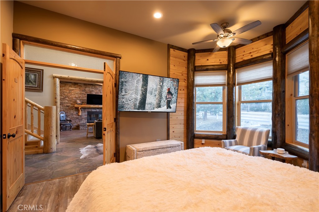 325 Stony Creek Road Big Bear Lake, CA 92315 - Photo 18 of 42 a bedroom with a large bed and a large window