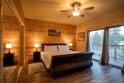 a bed room with a bed and a chandelier