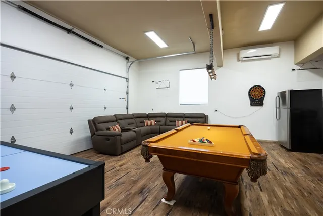 a room with pool table and a table