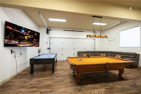 a room with wooden floor and furniture