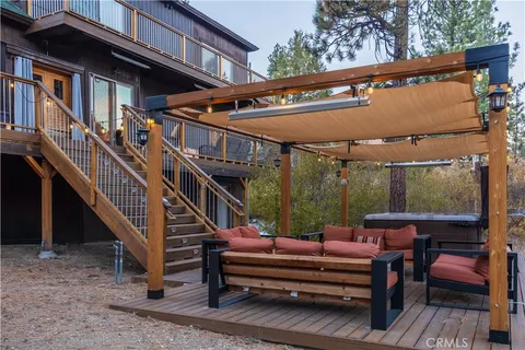 a view of a two chairs in the balcony