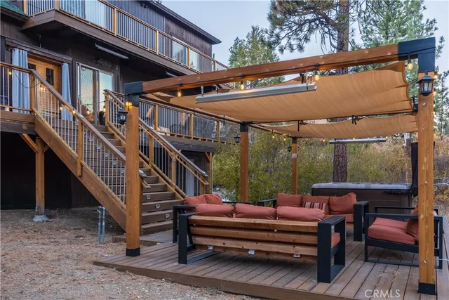 a view of a two chairs in the balcony
