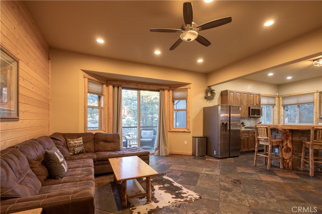 325 Stony Creek Road Big Bear Lake, CA 92315 - Photo 7 of 42 a living room with furniture and kitchen view