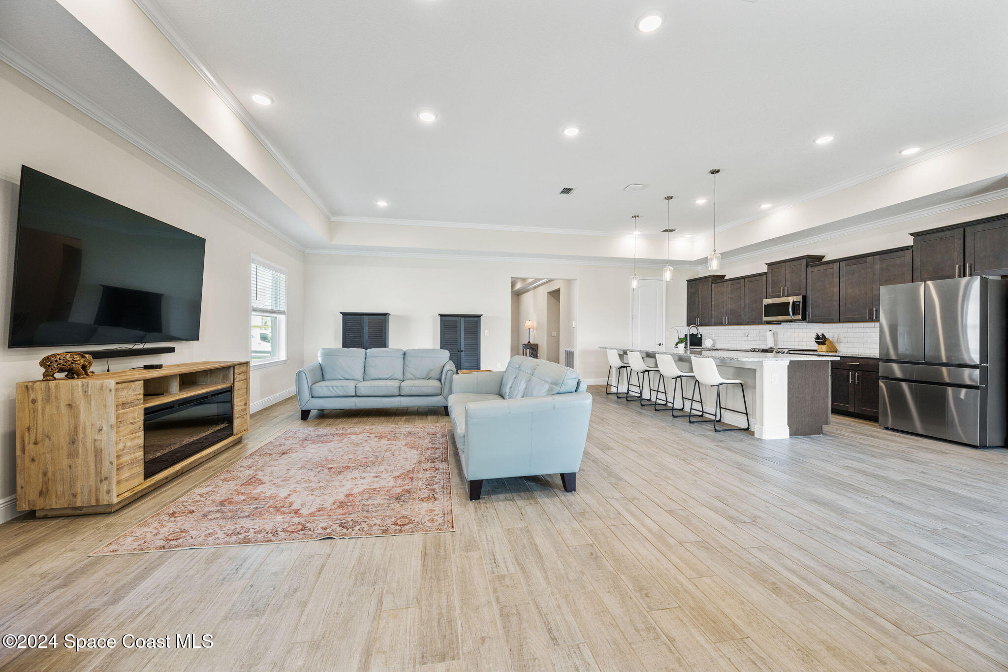 3500 Rixford Way Palm Bay, FL 32909 - Photo 14 of 55 a living room with furniture and flat screen tv