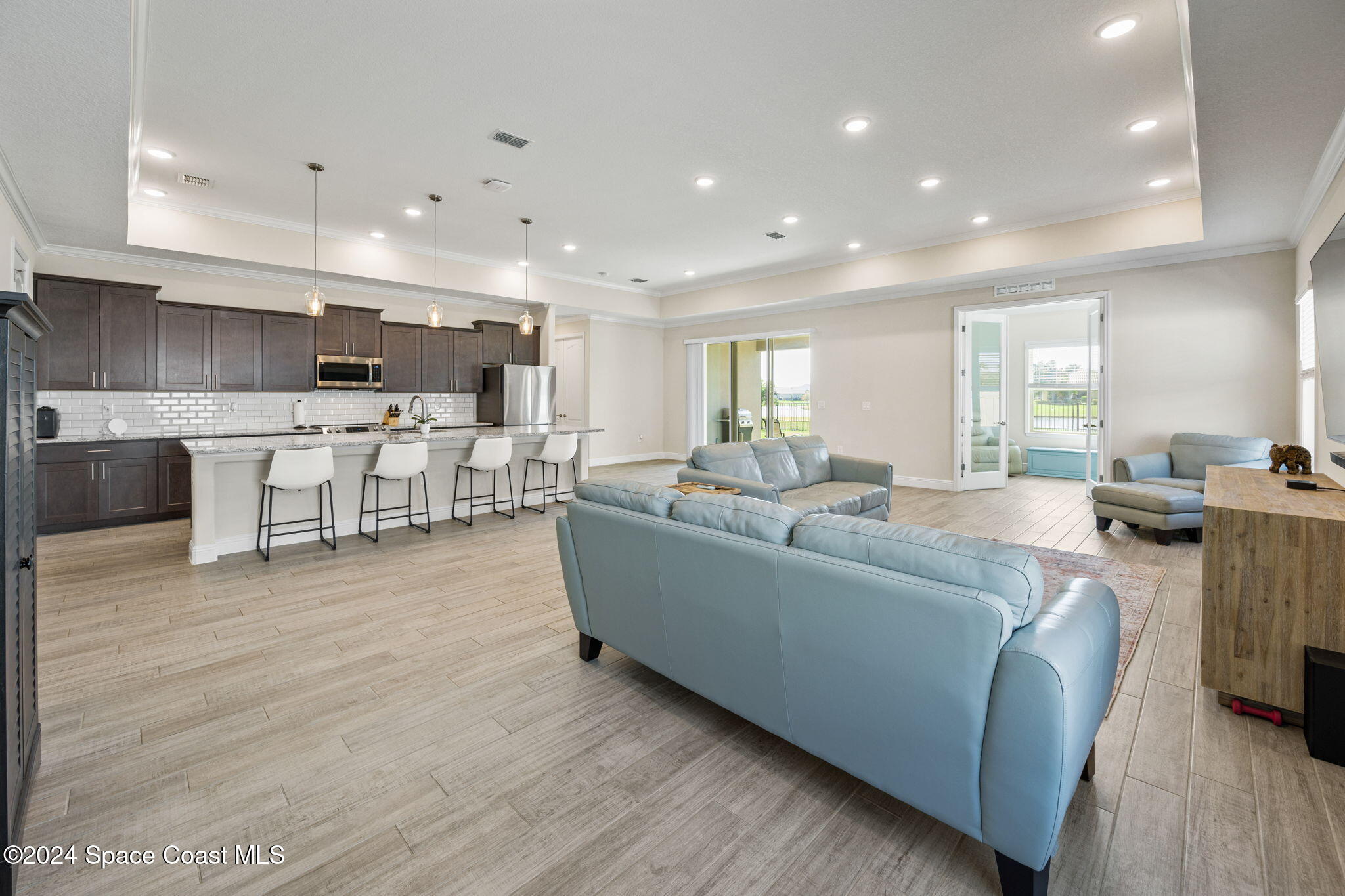 3500 Rixford Way Palm Bay, FL 32909 - Photo 15 of 55 a living room with furniture and a wooden floor