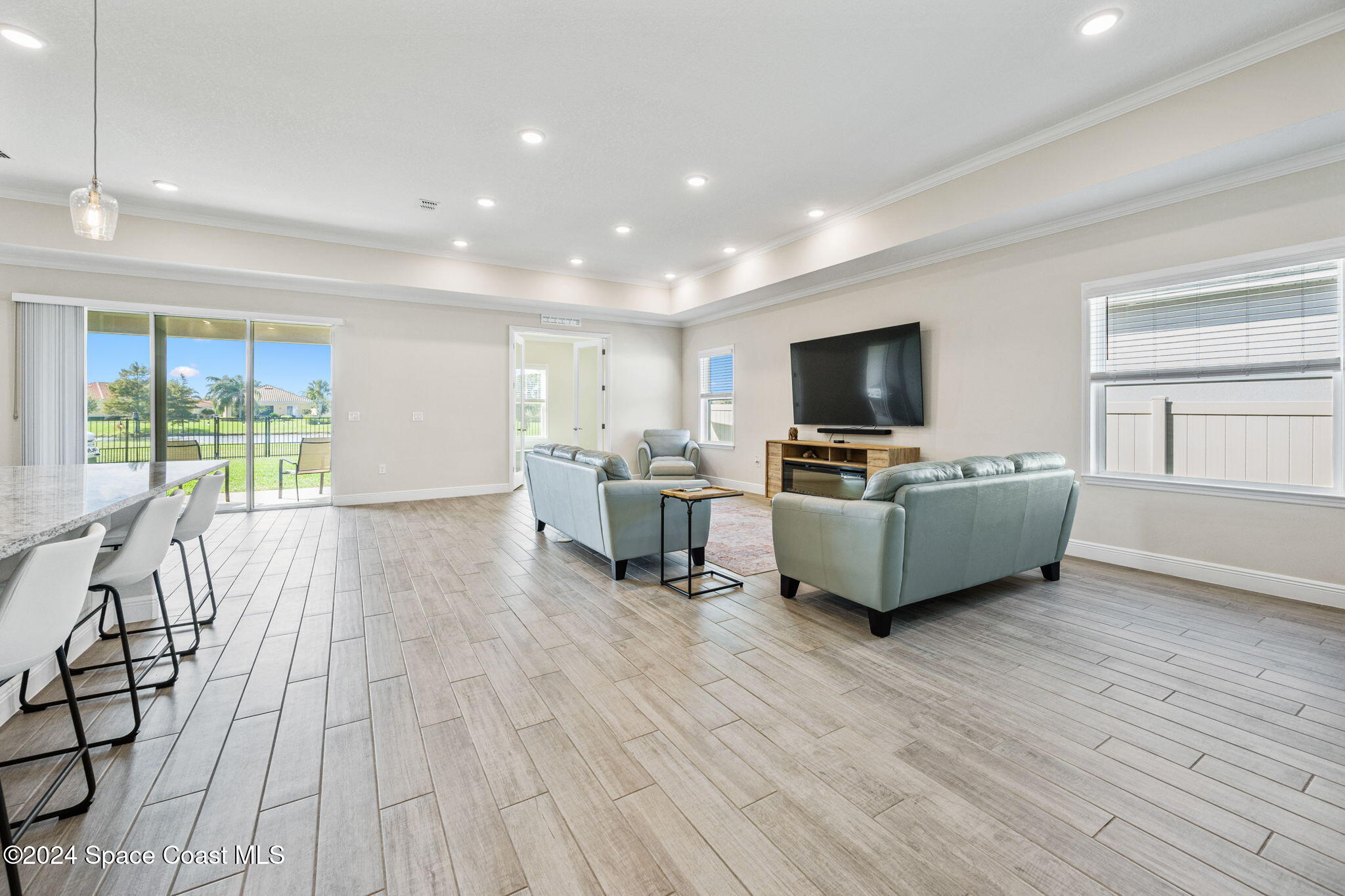 3500 Rixford Way Palm Bay, FL 32909 - Photo 16 of 55 a living room with furniture and a flat screen tv