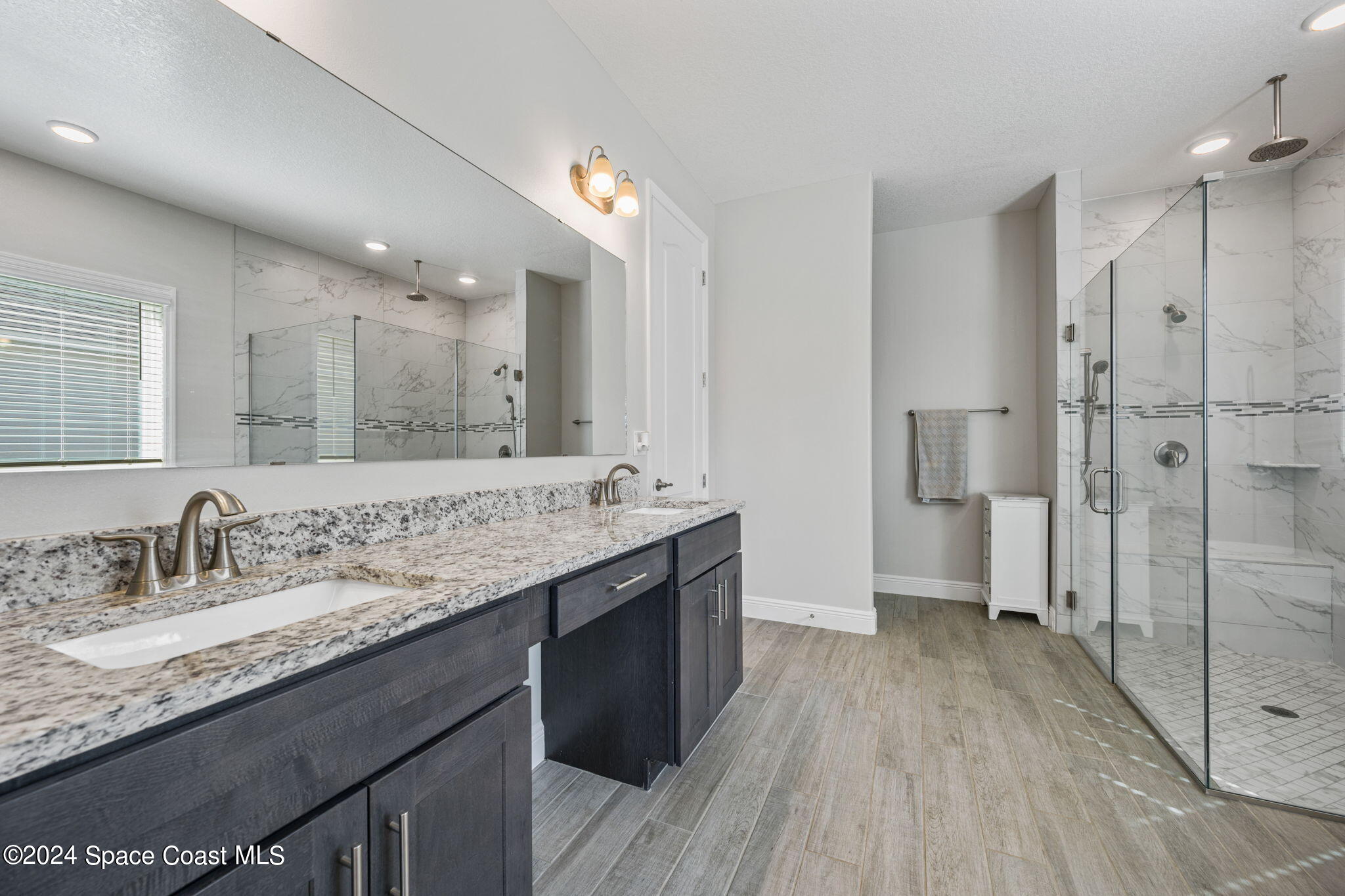 3500 Rixford Way Palm Bay, FL 32909 - Photo 20 of 55 a bathroom with a granite countertop double vanity sink and mirror