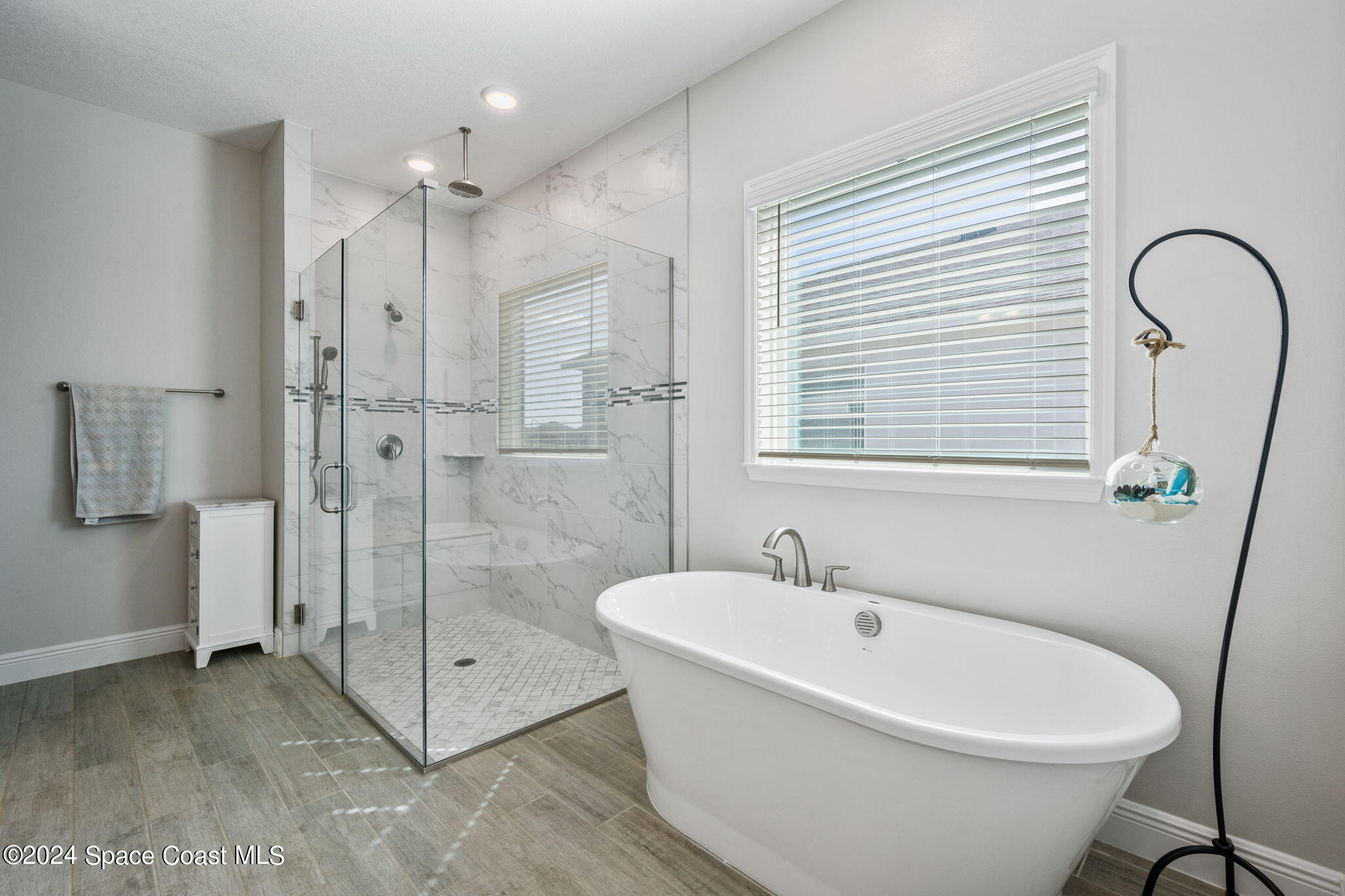3500 Rixford Way Palm Bay, FL 32909 - Photo 21 of 55 a white bath tub sitting next to a bathroom sink