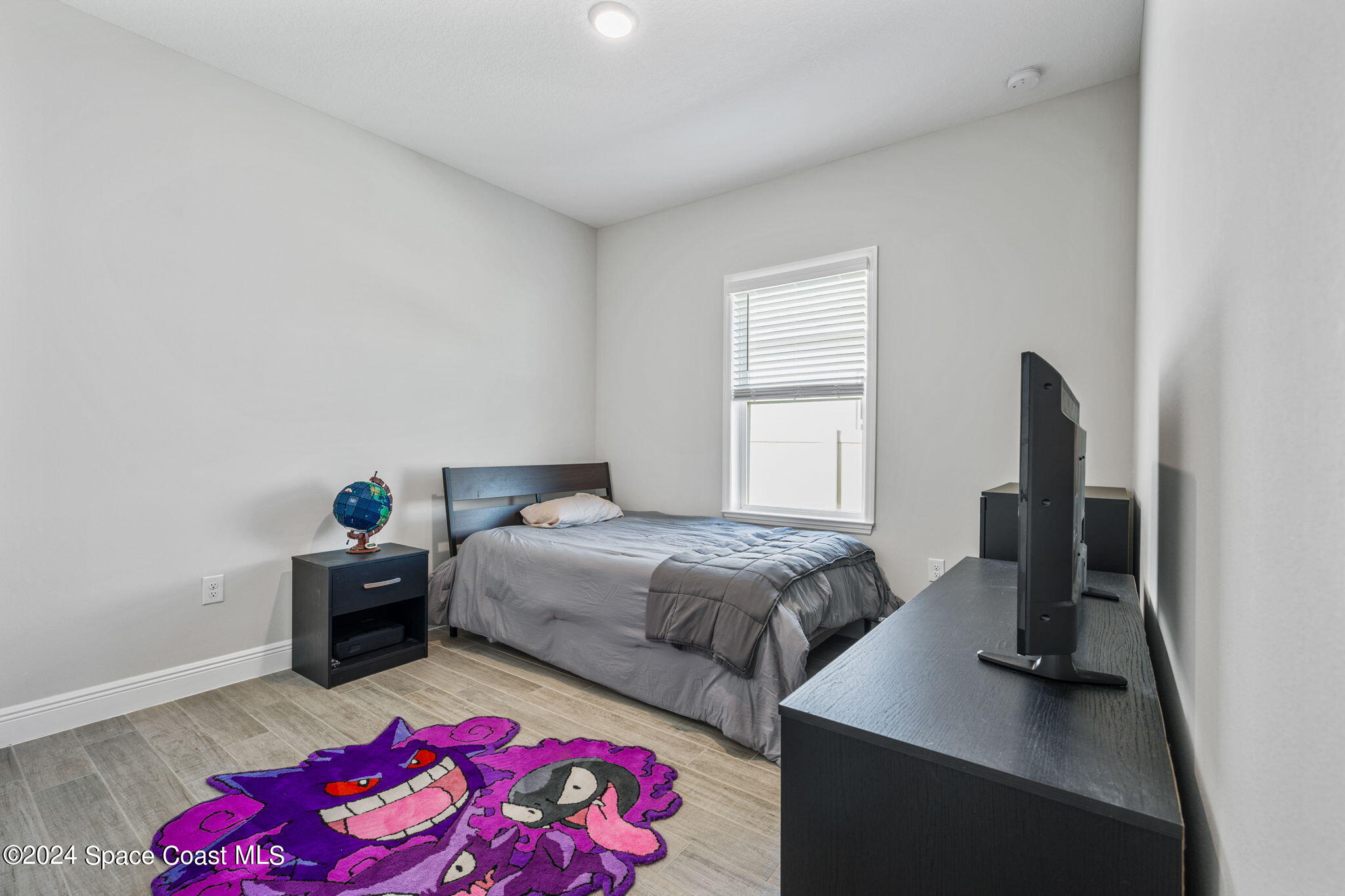 3500 Rixford Way Palm Bay, FL 32909 - Photo 24 of 55 a bedroom with a bed and a wooden floor