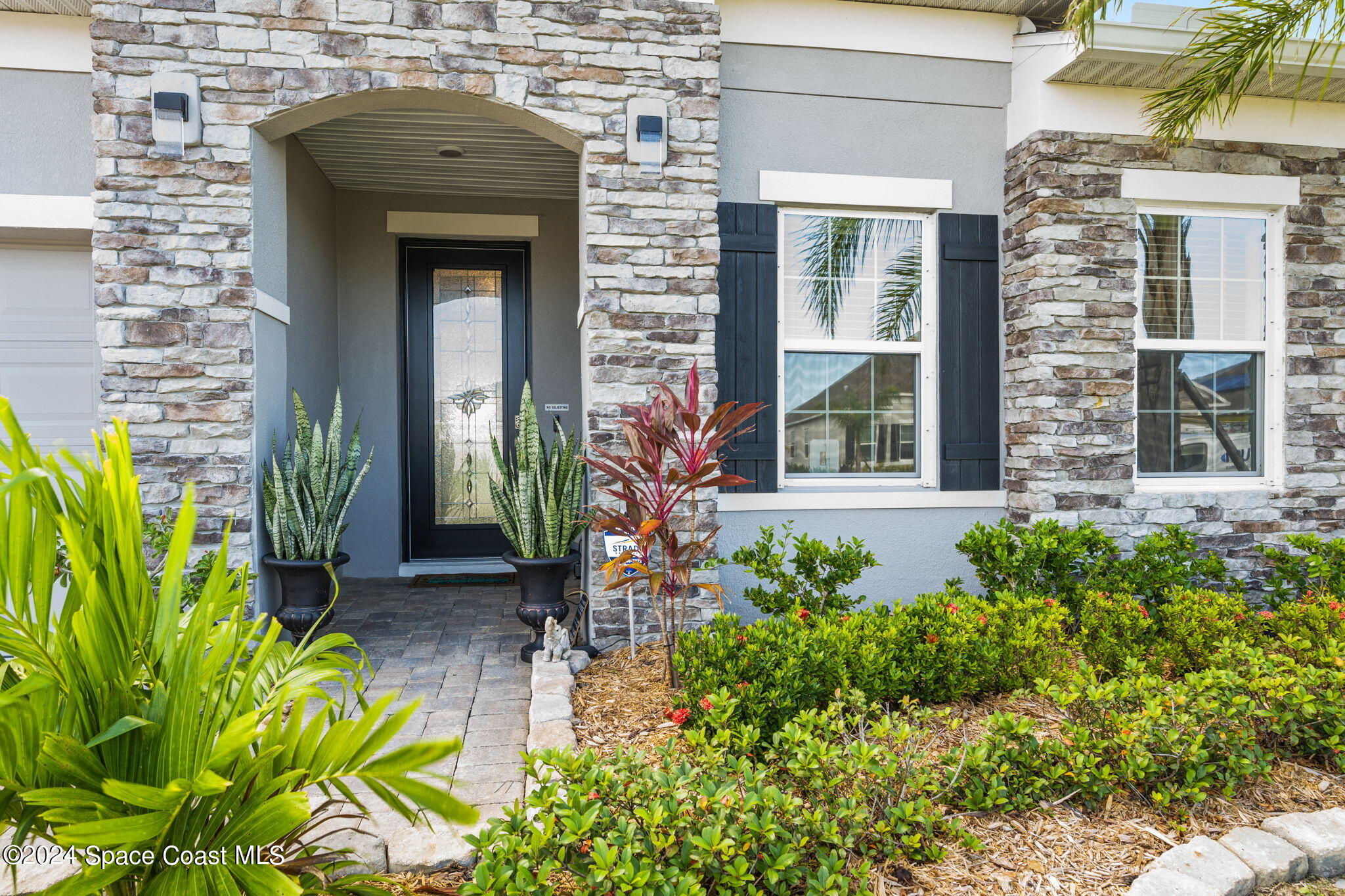 3500 Rixford Way Palm Bay, FL 32909 - Photo 3 of 55 a house with a lot of flower plants