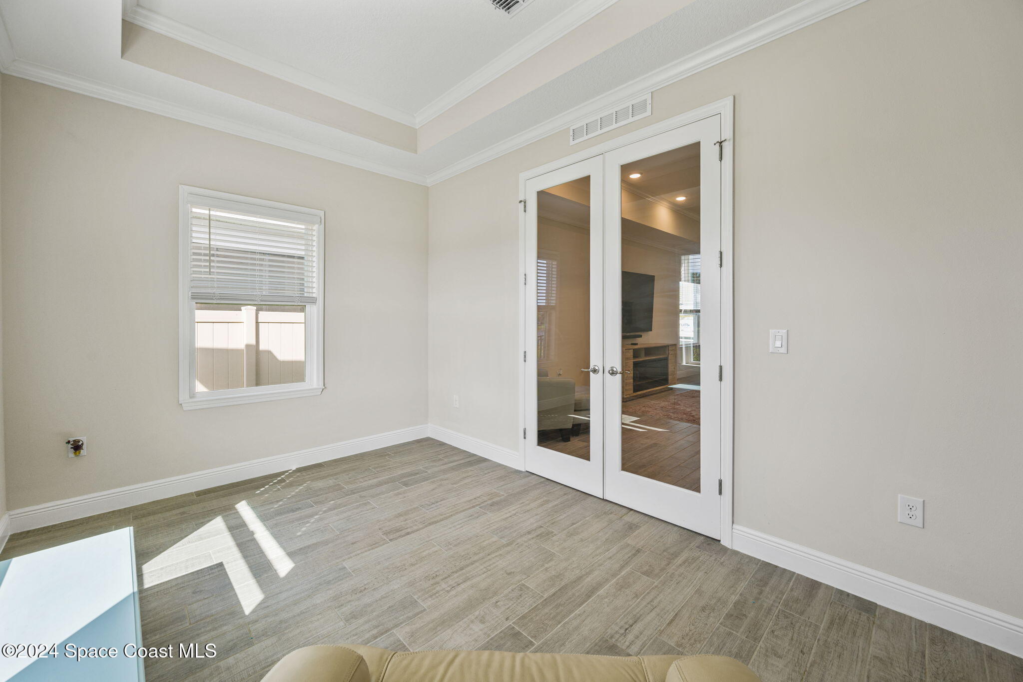 3500 Rixford Way Palm Bay, FL 32909 - Photo 34 of 55 an empty room with wooden floor and windows