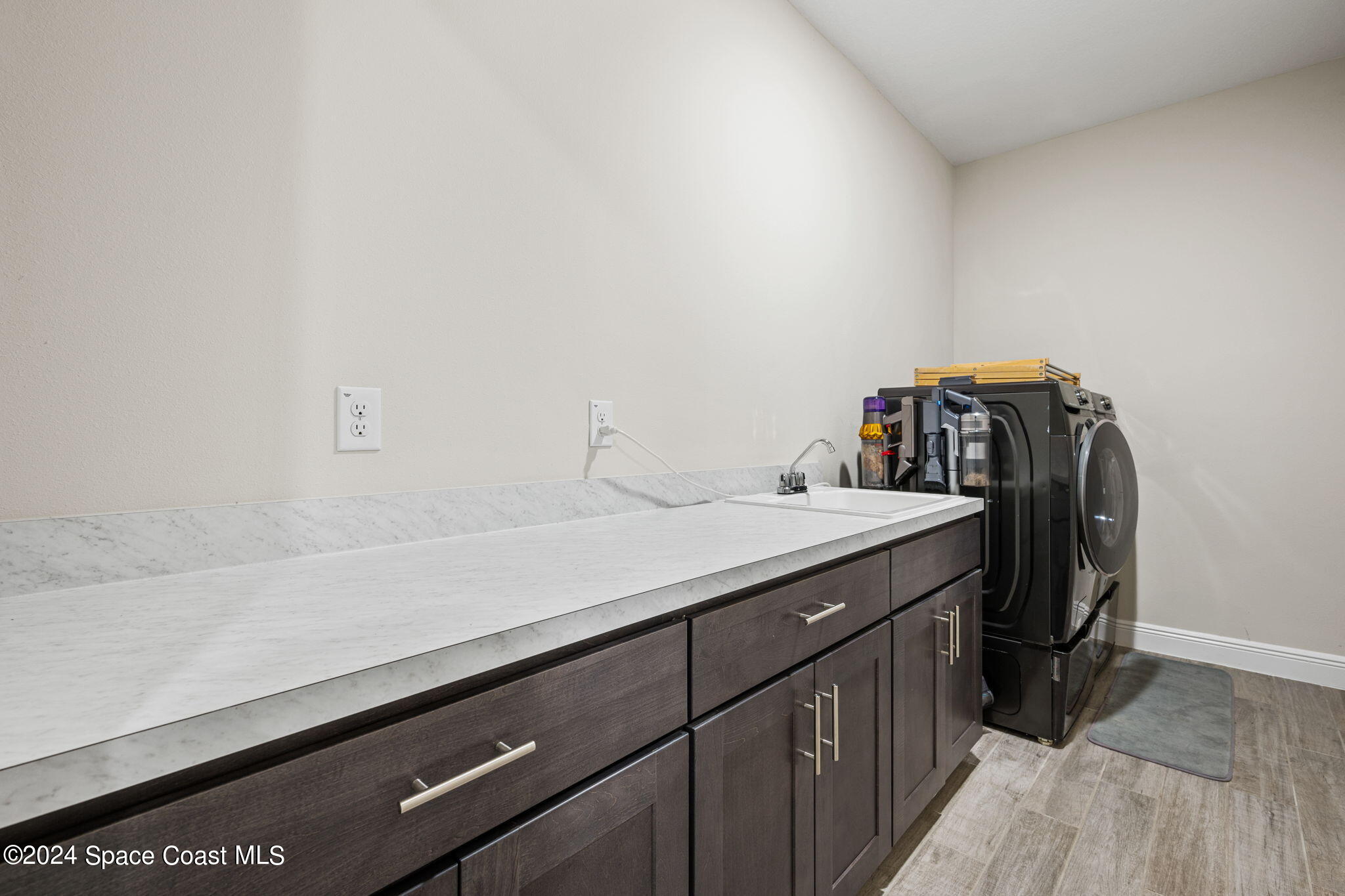 3500 Rixford Way Palm Bay, FL 32909 - Photo 35 of 55 a utility room with cabinets