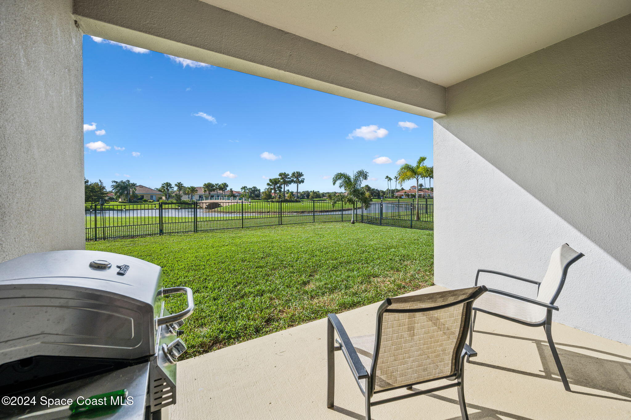 3500 Rixford Way Palm Bay, FL 32909 - Photo 38 of 55 a view of a two chairs in patio and a yard