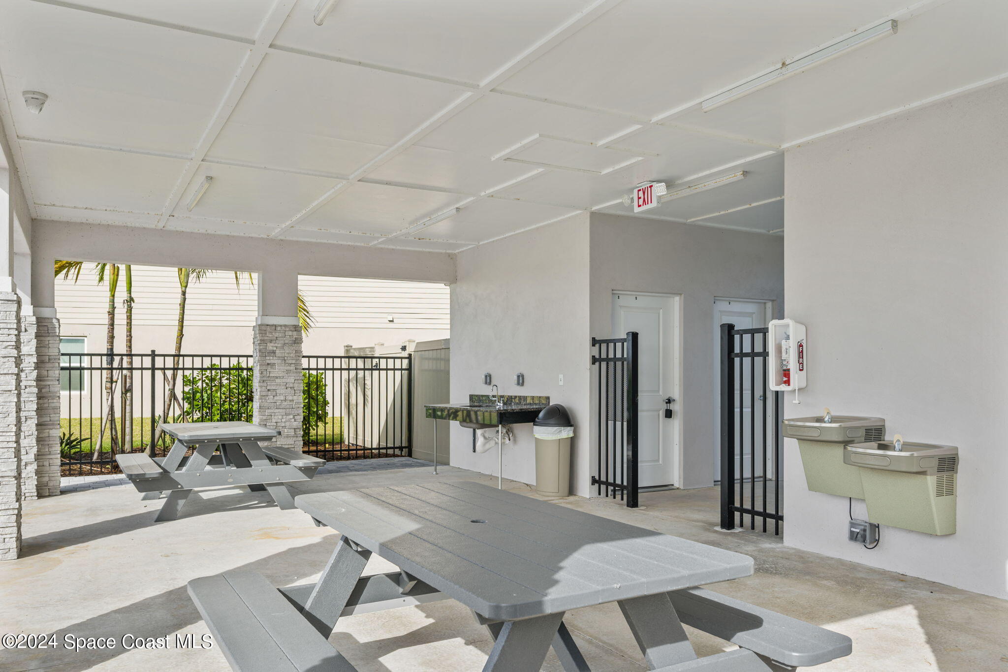 3500 Rixford Way Palm Bay, FL 32909 - Photo 50 of 55 a living room with furniture a large window and wooden floor