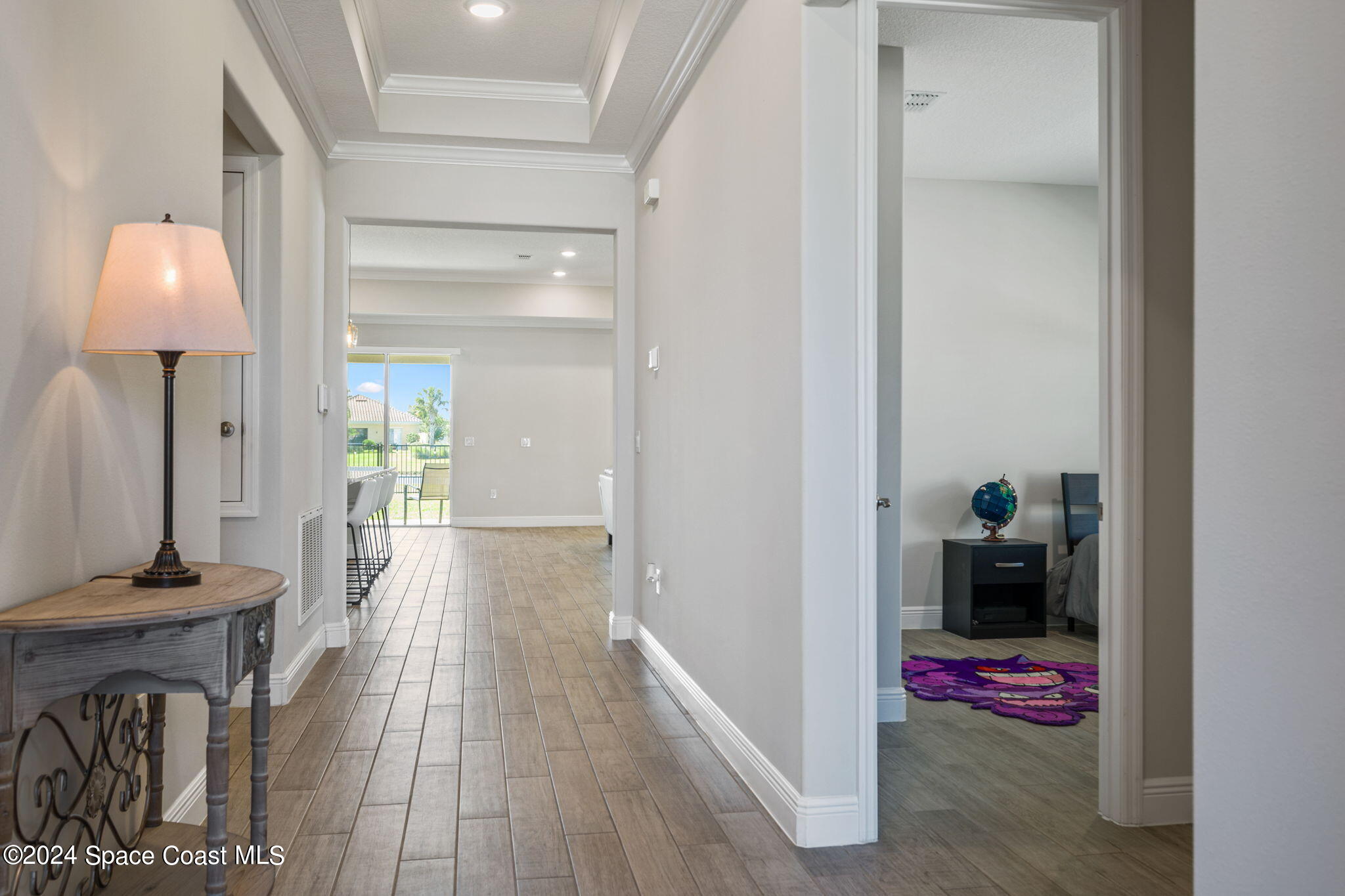 3500 Rixford Way Palm Bay, FL 32909 - Photo 5 of 55 a view of a hallway with wooden floor and a living room