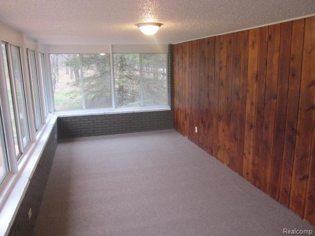 880 West Livingston Road Highland, MI 48357 - Photo 17 of 29 All Seasons Room w/ New Carpet and Plenty of Views!