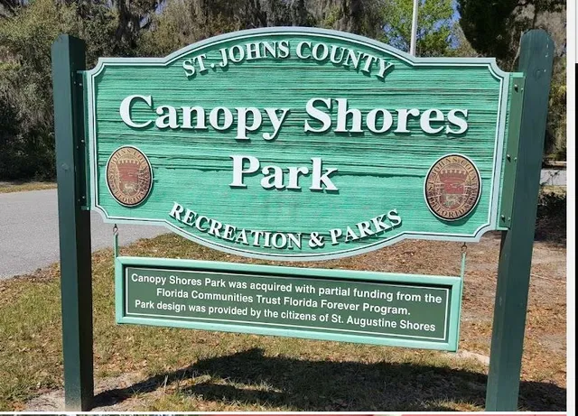 a view of staircase with wooden floor and a potted plant