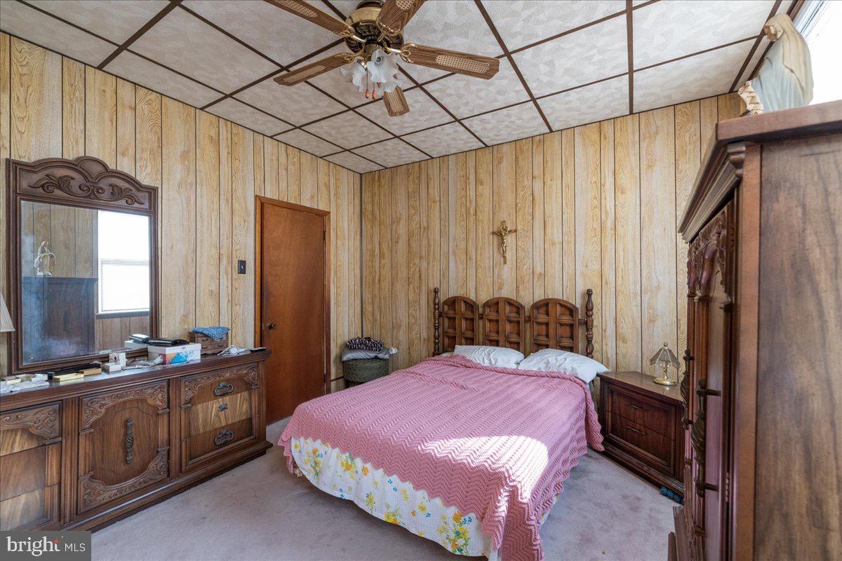 1229 Jackson Street Philadelphia, PA 19148 - Photo 13 of 29 a bedroom with a bed and a mirror