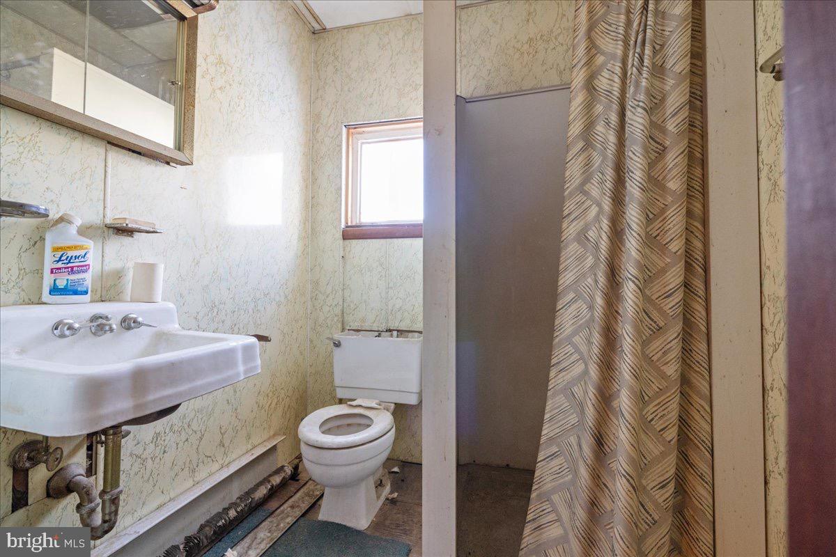 1229 Jackson Street Philadelphia, PA 19148 - Photo 23 of 29 a bathroom with a sink toilet and shower