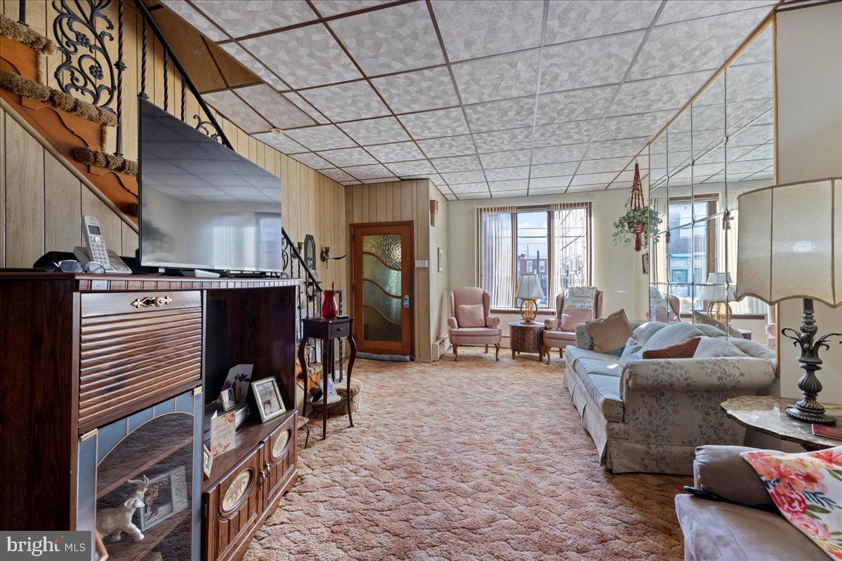 1229 Jackson Street Philadelphia, PA 19148 - Photo 5 of 29 a living room with furniture and a chandelier