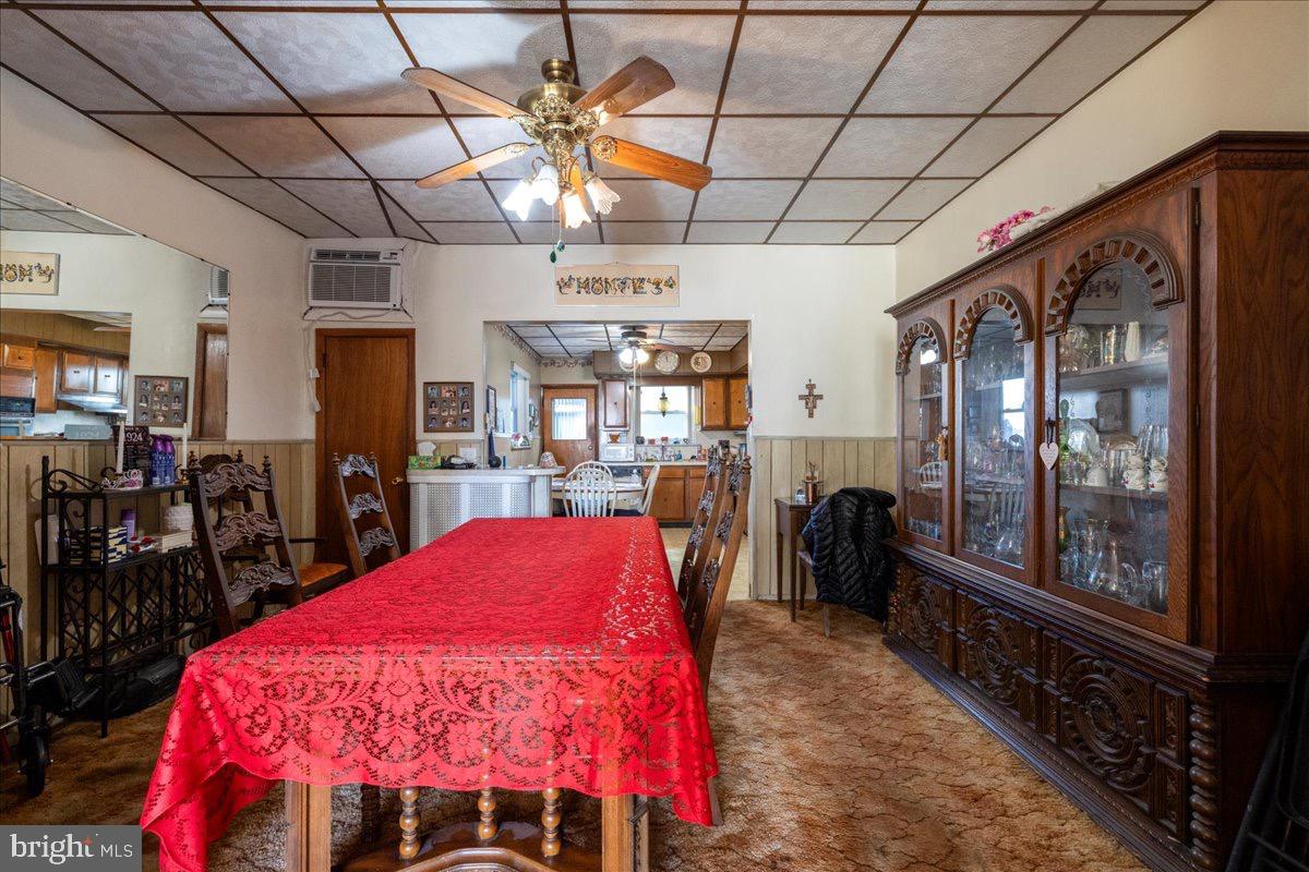 1229 Jackson Street Philadelphia, PA 19148 - Photo 6 of 29 a large kitchen with a table and chairs
