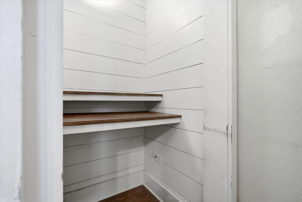 511 East Chestnut Street Bloomington, IL 61701 - Photo 11 of 32 a view of walk in closet with empty racks